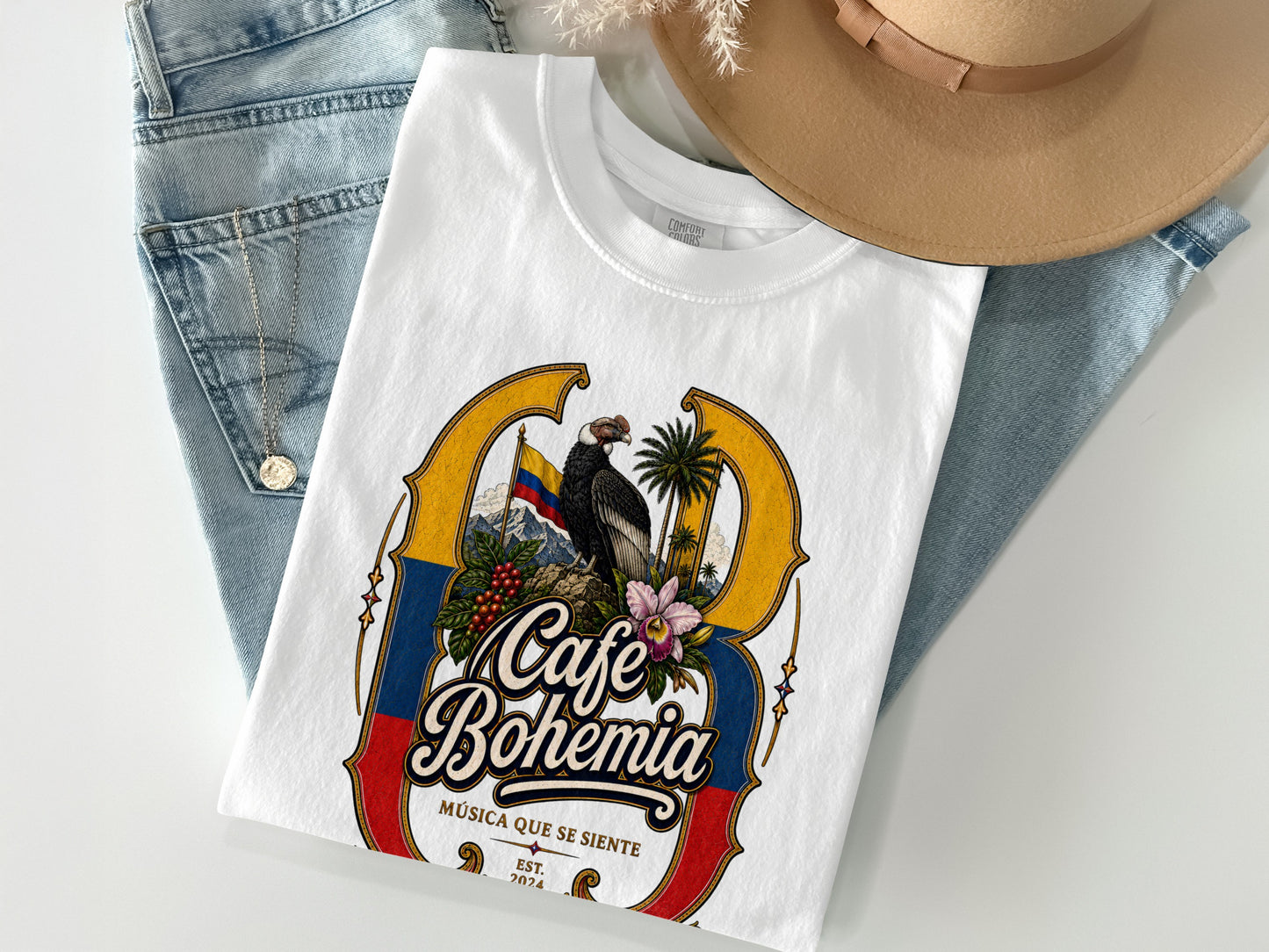 White t-shirt with "Cafe Bohemia" text, condor, coffee, flowers, and Colombian flag.