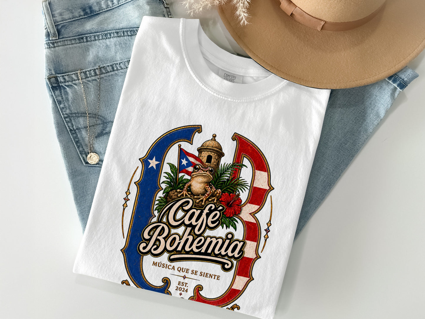 White t-shirt with "Café Bohemia" logo featuring a frog, flag, and tower.