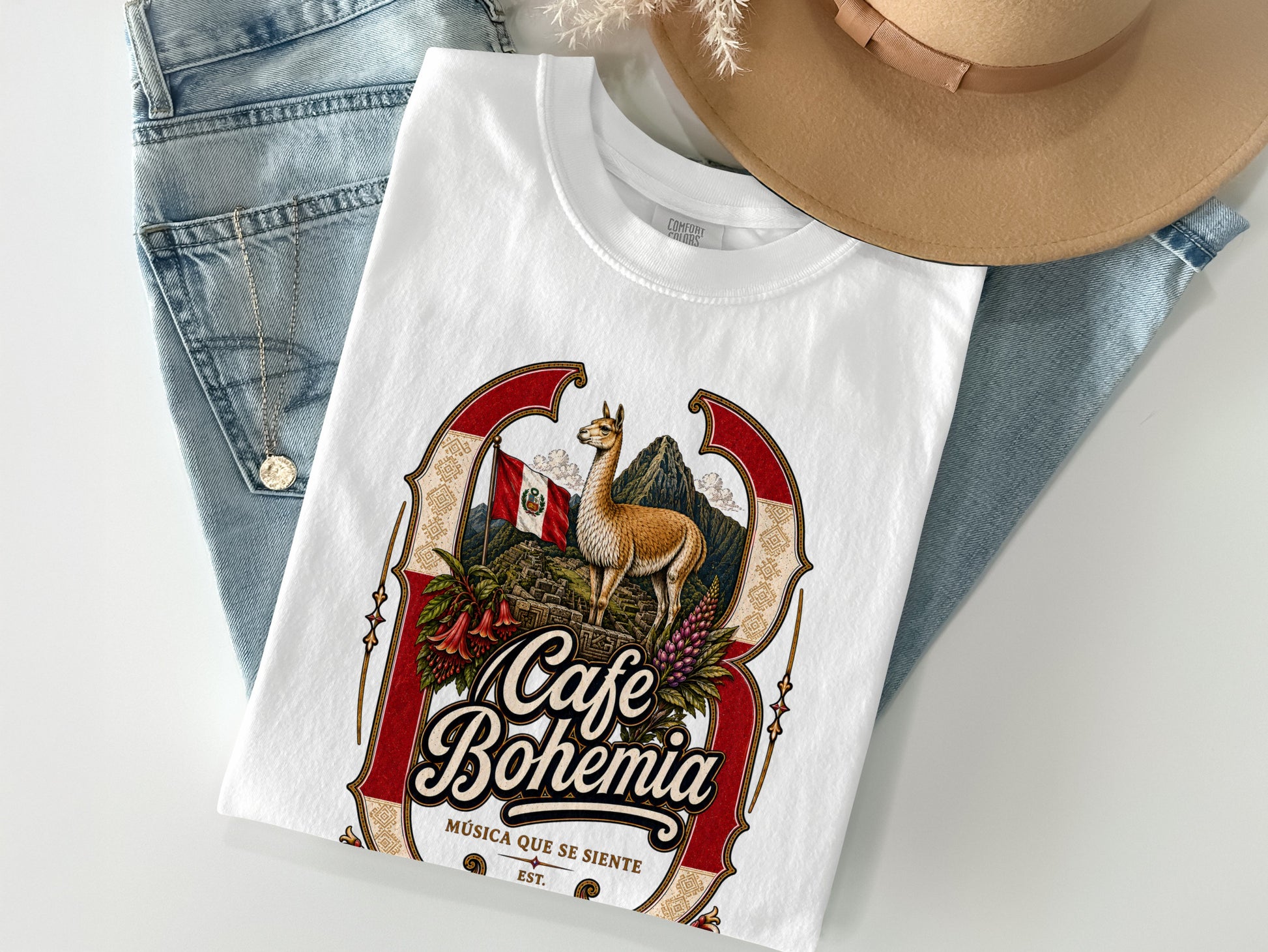 White t-shirt with Cafe Bohemia graphic featuring llama, Machu Picchu, and Peruvian flag.