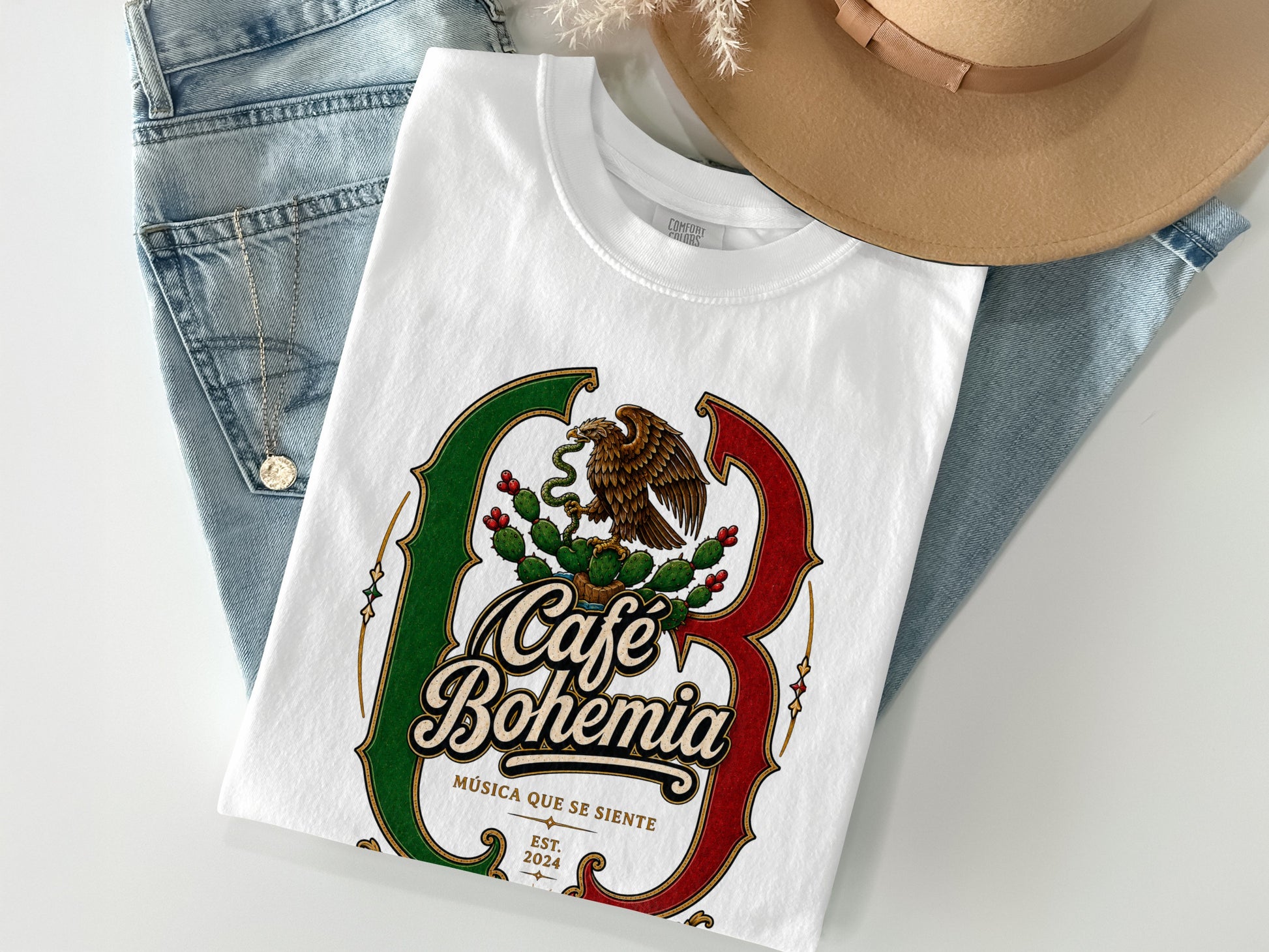 White t-shirt with "Café Bohemia" logo, eagle, cactus, and text.