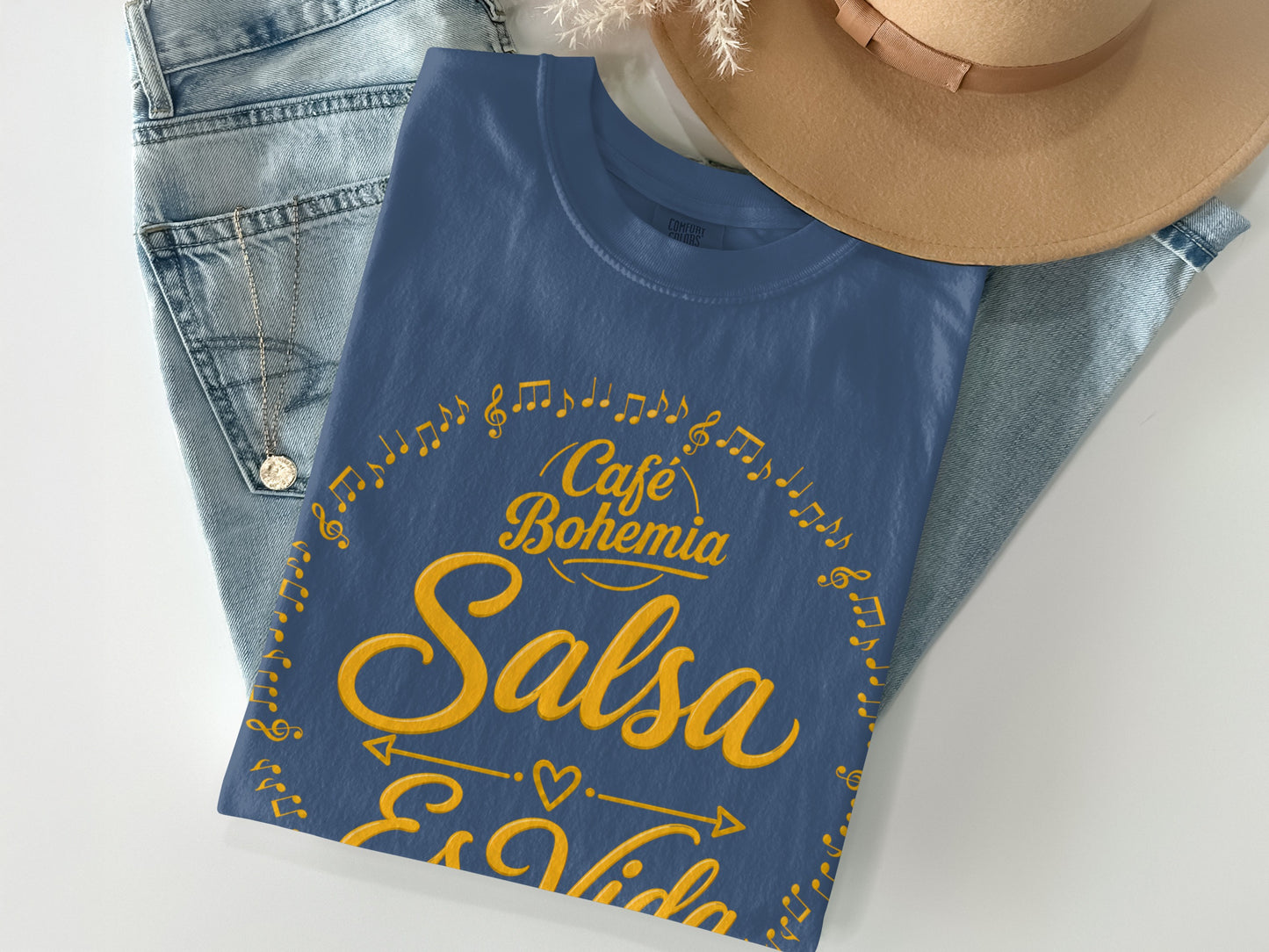 Blue t-shirt with "Café Bohemia Salsa Es Vida" and musical notes design.