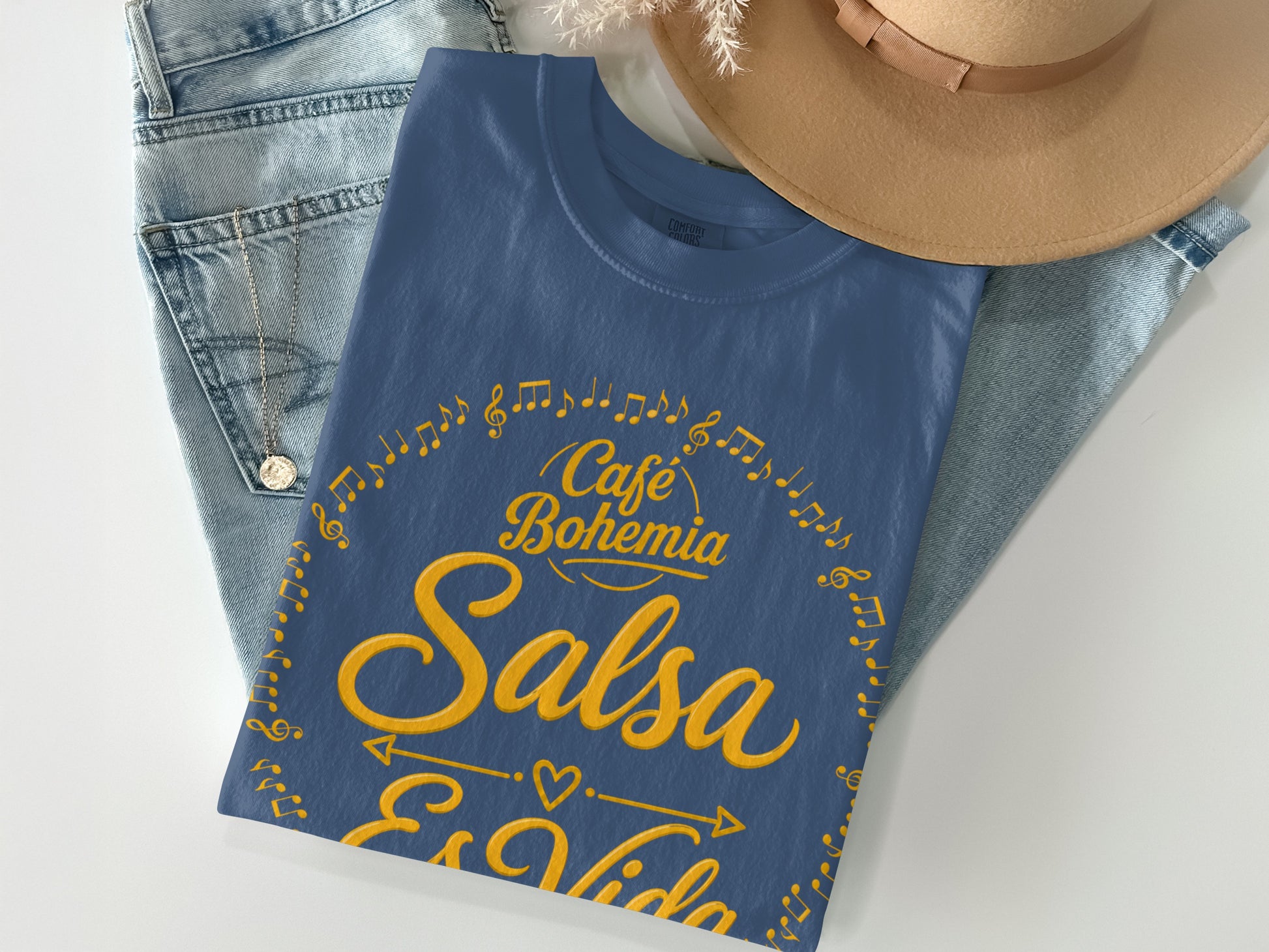 Blue t-shirt with "Café Bohemia Salsa Es Vida" and musical notes design.